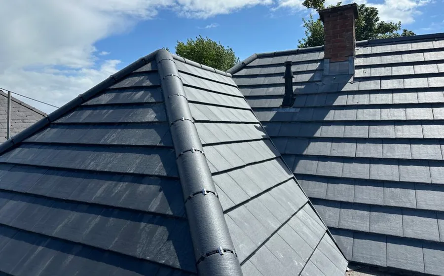 A genuine D.J.K Roofcare job — our team working on a pitched roof